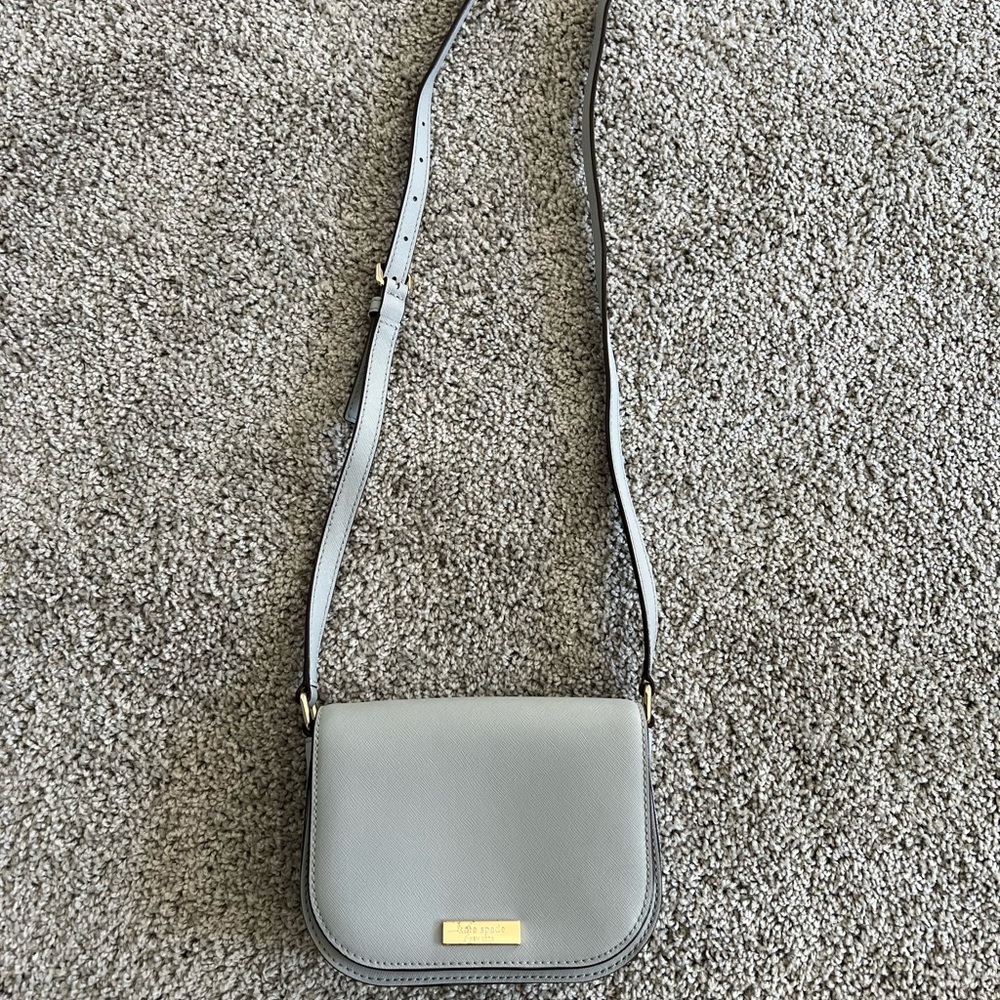 Kate Spade Laurel Way Crossbody small. Light gray with soft hues of blue.